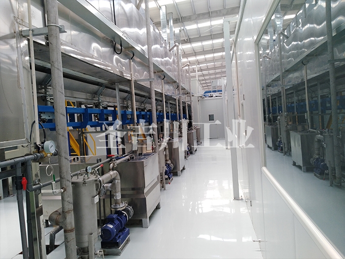 Continuous pass-through ground rail spray pretreatment line